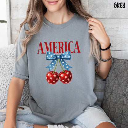 AMERICA Shirt | Coquette 4th of July Tee | Blue Star Bow with Cherries | Comfort Colors Patriotic Shirt | Cute USA Summer Shirt